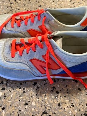 New Balance Light Blue and Sneakers with Bright Orange Accents